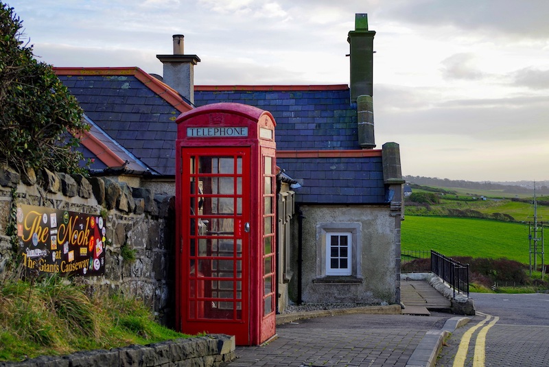 Red Phone Booth in Small Irish Village