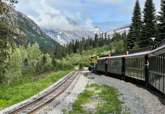 Whitepass Train going around the bend next to another set of tracks